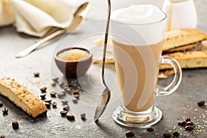 Hot coffee latte with biscotti cookies