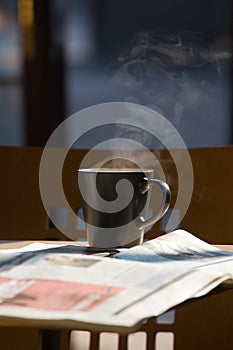 Hot coffee and newspapers