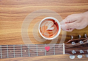 .Hot coffee with people who are fond of acoustic guitar music.