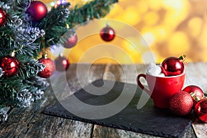 Hot coffee or tea cup with lump sugar and christmas balls