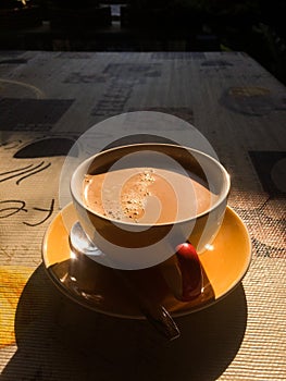 Hot coffee and warm morning sun