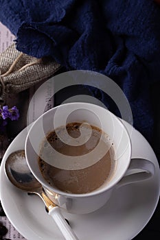 Hot coffee in white ceramic mug