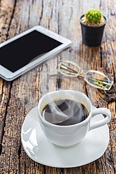 Hot coffee on wood table