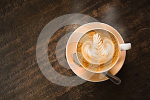 Hot coffee on wood table