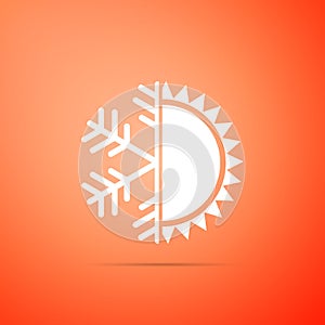 Hot and cold symbol. Sun and snowflake icon isolated on orange background. Winter and summer symbol. Flat design. Vector