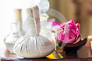 Hot Compress Massage. Spa compress ball and lotus flower