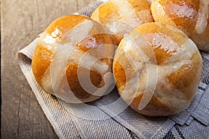 Hot cross buns on basket Top view, copy space. Easter baking