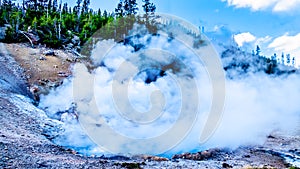 Hot and Crystal Clear Blue Water in the Beryl Spring Geyser in Yellowstone National Park in Wyoming, USA