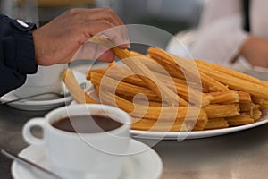 Hot cup of chocolate with artisenal churros