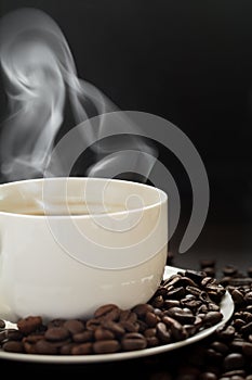 Hot cup of coffee with smoke