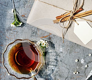 Hot cup of tea on table