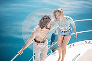 Hot dating lovers on the luxury boat in open sea in summer.