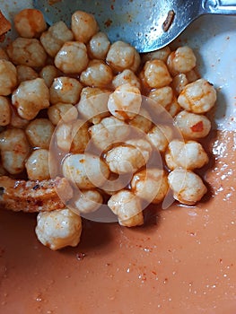 Hot delicios snack with chili sauce photo