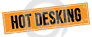 HOT DESKING text on black orange grungy rectangle stamp photo