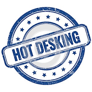 HOT DESKING text on blue grungy round rubber stamp