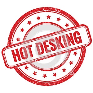 HOT DESKING text on red grungy round rubber stamp