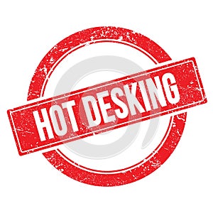 HOT DESKING text on red grungy round stamp