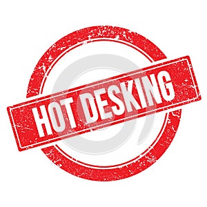 HOT DESKING text on red grungy round stamp photo