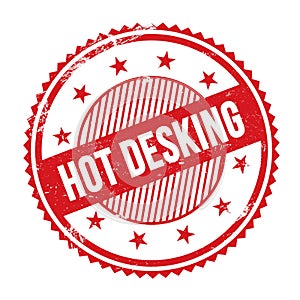 HOT DESKING text written on red grungy round stamp