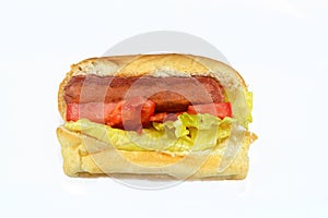 hot dog in a bun with lettuce and tomato slices, grilled beef sausage called wiener (Vienna sausage)