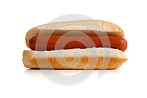 Hot dog and bun on white