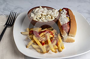 hot dog with french fries and macaroni salad