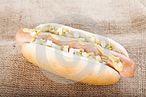 Hot dog grill with mustard, onion and pickles