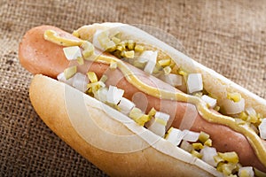 Hot dog grill with mustard, onion and pickles