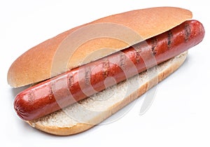 Hot dog - grilled sausage in a bun isolated on white background