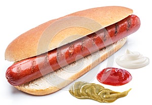 Hot dog - grilled sausage in a bun isolated on white background