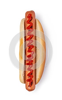 Hot dog with ketchup on white