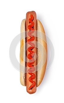 Hot dog with ketchup on white