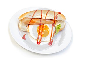 Hot Dog sausage, fried egg and vegetables with tomato sauce in white plate