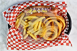 hot dog served with french fries and onion rings