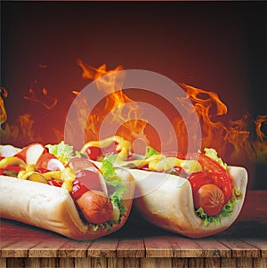 Hot dog on the table against the background of fire