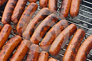 Hot Dogs on a Charcoal BBQ Grill