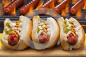 Hot Dogs Grilled in Buns Barbecue Grill Background