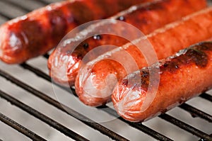 Hot dogs grilling