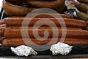 Hot dogs with seasonings on grill