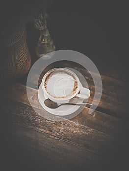 Hot drink coffee on wood table in dark scene