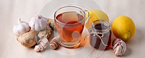 Hot drink with honey, lemon and ginger for cough remedy, seasonal autumn winter alternative medicine beverage, traditional flu
