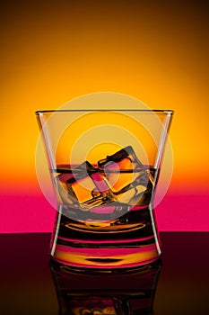 Hot drink shots in bar on color abstract background