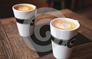 Hot drinks. A cup of caffe latte or cappuccino on a table in a Espresso House cafe.