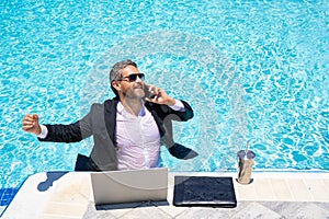 Hot excited business. Funny excited office worker. Business man in suit work online in beach. Travel and business. Crazy