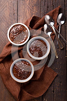 Hot festive French dessert. Chocolate pudding in Ceramic Bakeware. top view