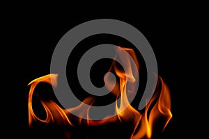Hot flames on a black background. Beautiful flame of fire in the dark. Abstract of burning flames and smoke