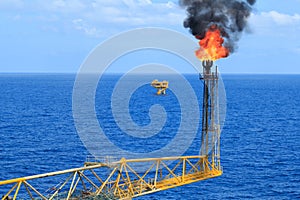 Hot flare boom and fire on offshore production platform