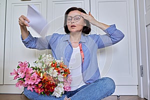 Hot flashes in a woman of mature age, symptoms of menopause photo