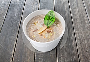 Hot food delivery - mushroom soup at wood