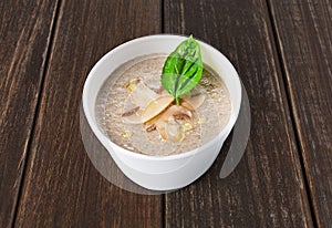 Hot food delivery - mushroom soup at wood